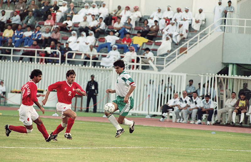 Iran’s Javad Zarinchech (centre) and Iraqi captain Ahmad Radhi (right) during their World Cup qualifying game, 22nd October 1993. Photo: Santiago Lyon/AP/Press Association Images