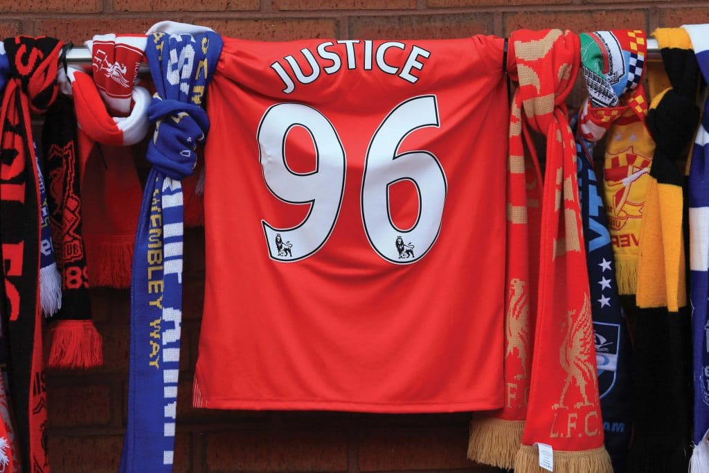 Red Arsenal t shirt with 'justice' on the back