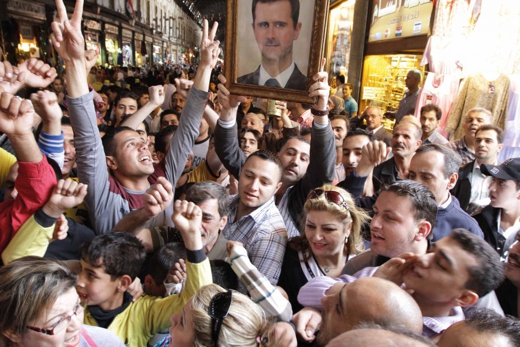 Syrians rally to show their support for President Bashar al-Assad in Damascus on 30th April 2011, after the US called for an investigation into bloodshed during clashes between government forces and anti-regime protesters