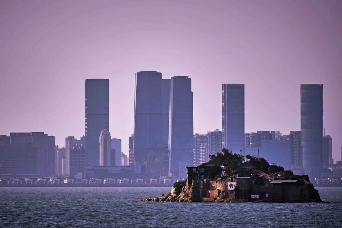 A tiny islet, part of the Kinmen islands, is pictured with the Chinese city of Xiamen in the background. The Kinmen islands are Taiwanese territory, but lie just off the coast of mainland China