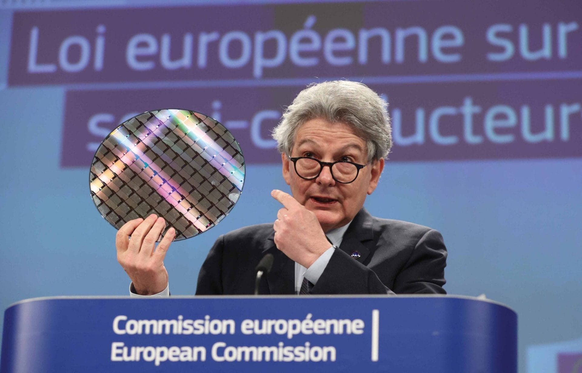  Thierry Breton, European commissioner for the internal market, brandishes a silicon wafer on which microchips are etched, during a meeting on the chips act at the EU headquarters in Brussels, 8th February 2022
