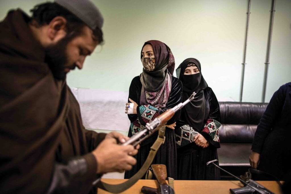 Women and children in a classroom at a police barracks in Kabul where women are training to be police officers. Many of the women are the sole breadwinners of their families and also have to bring their children to class