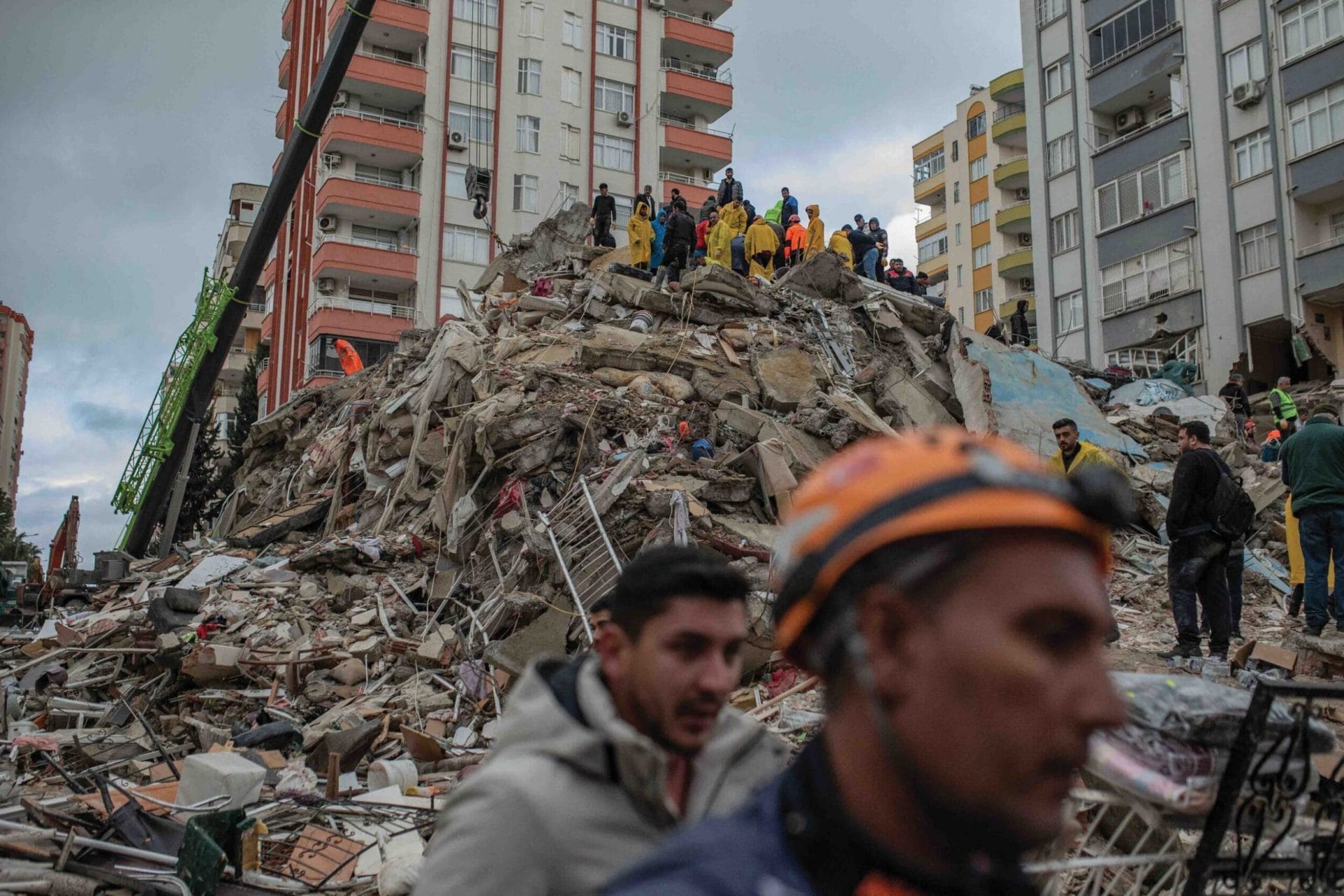 Rescuers search for victims and survivors amid the rubble of a building that collapsed in Adana, southern Turkey, 6th February 2023