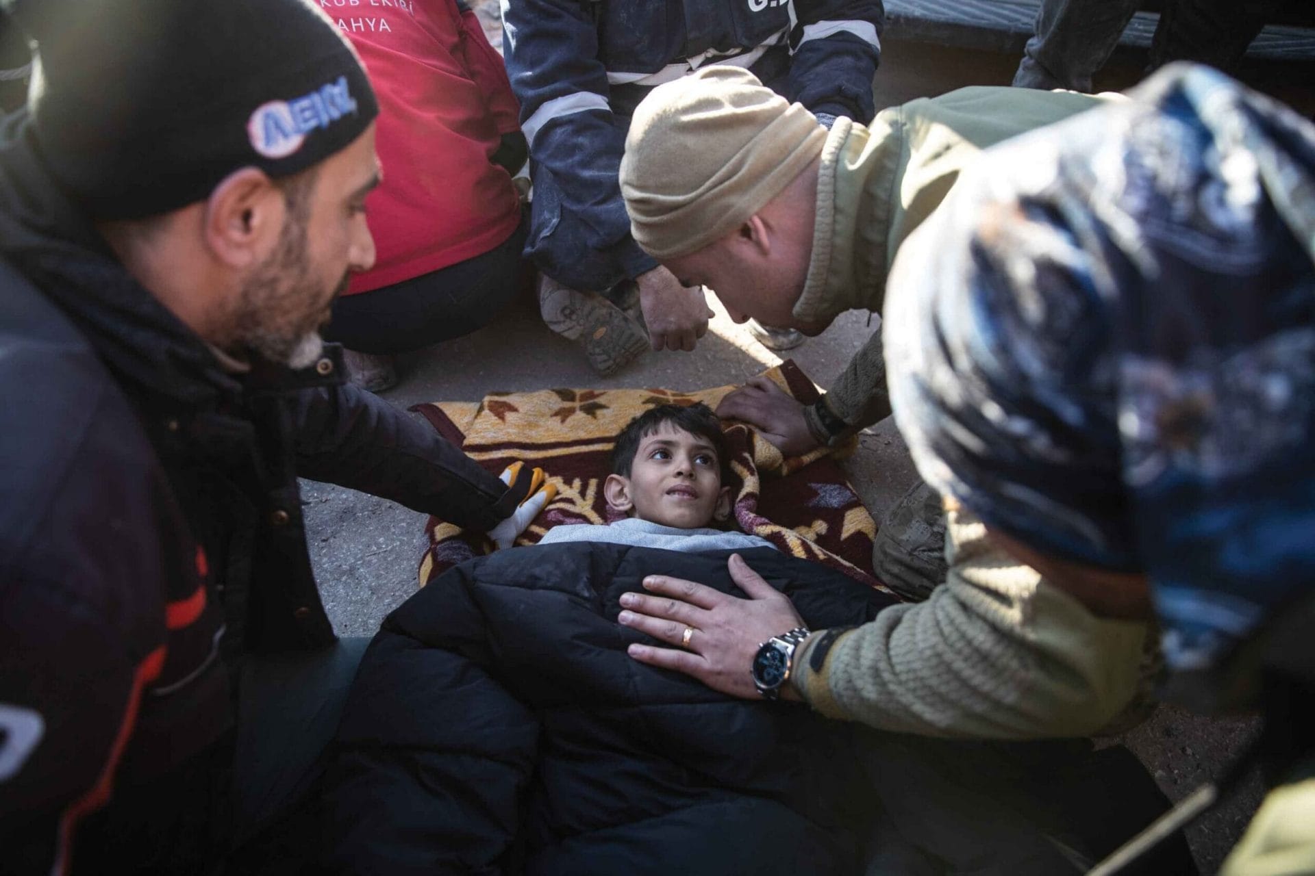 Rescue workers tend to Ahmet Findik, an 11-year-old survivor pulled from the rubble in Hatay 60 hours on from the earthquakes