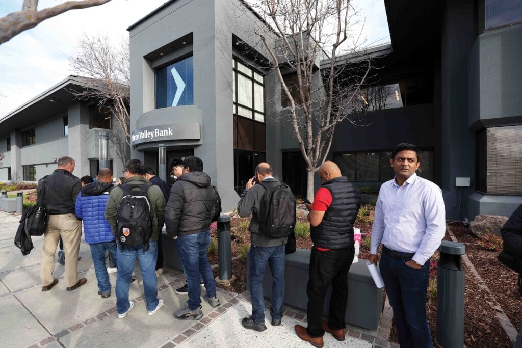 People queue outside a branch of Silicon Valley Bank in Santa Clara, California, on 13th March 2023, hoping to retrieve their funds from the failed bank