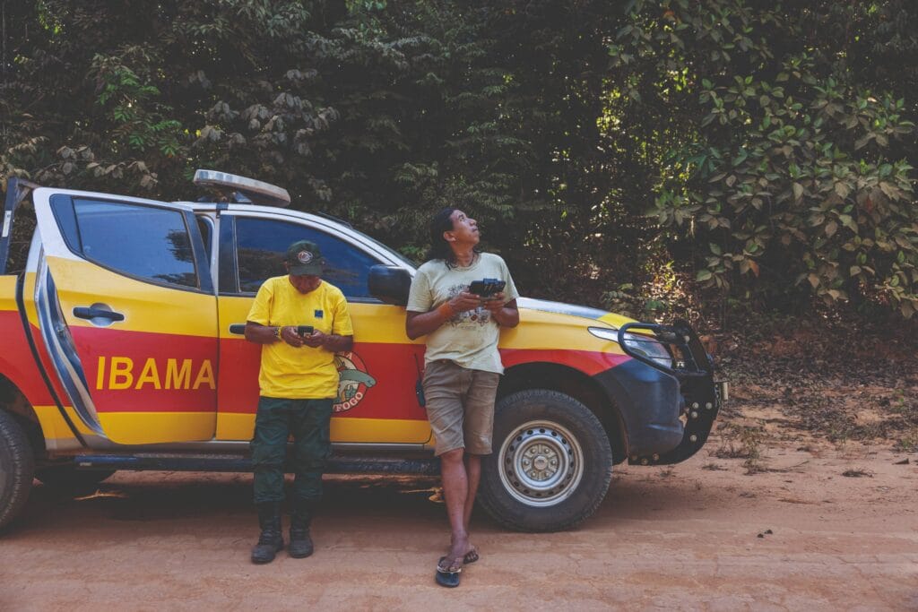 Kamikia Kisedje uses a drone to locate a fire outbreak near the Khikatxi village in the Wawi Indigenous Land, bordering the Xingu Indigenous Territory