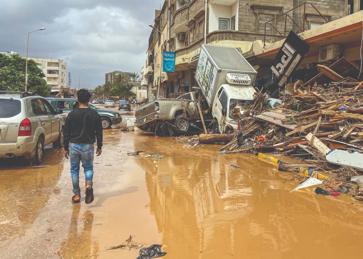 A survivor walks the streets of Derna shortly after the floods 