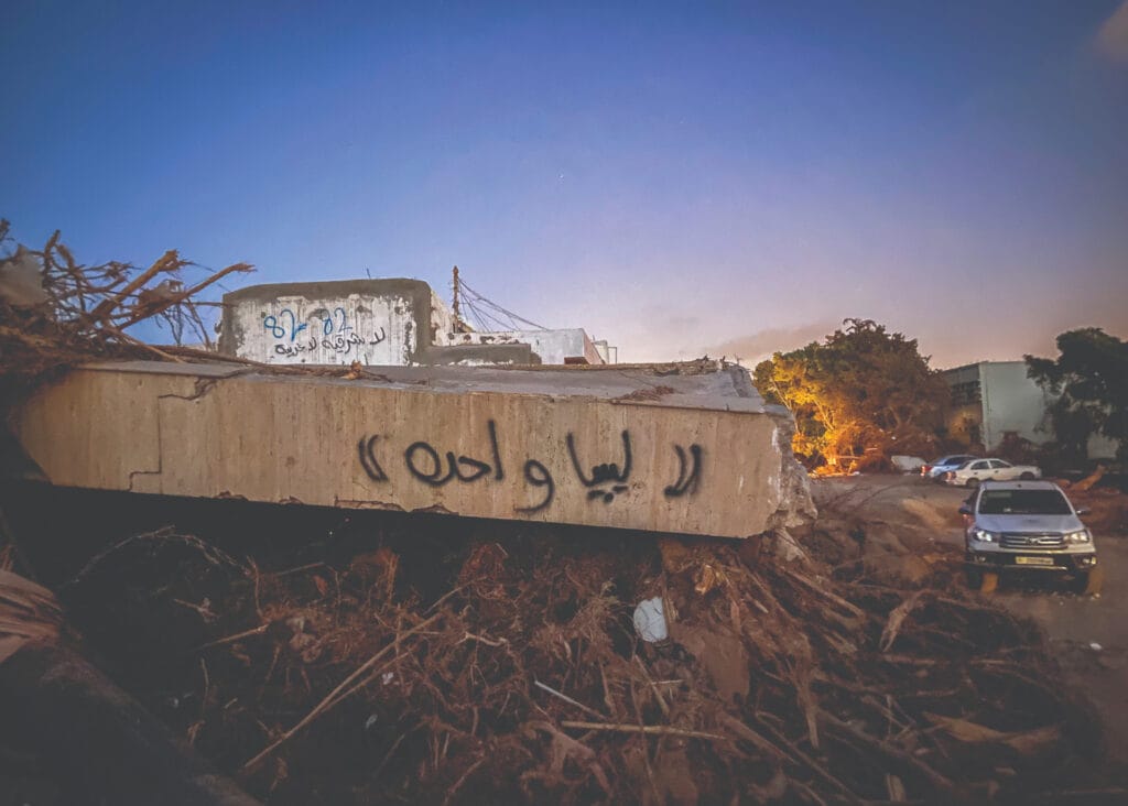 Graffiti proclaiming ‘Libya Waheda’ (‘One Libya’) on a destroyed building